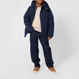 Model wearing Boss Kids Off White Marl Sweat Top, styled with navy padded jacket, dark jeans and tan trainers