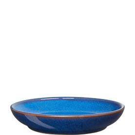 Denby Small Nesting Bowl in blue reactive glaze stoneware with warm brown rim, shallow wide form, viewed from above