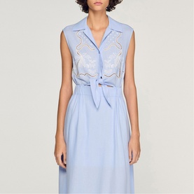 Model wearing Sandro Womens French Dress in sky blue with lace embroidered bodice, tie waist, sleeveless midi length