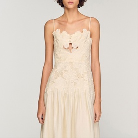 Model wearing Sandro Womens French Dress in clear, featuring scalloped neckline, lace embroidery bodice, keyhole cutout, and drop-waist skirt