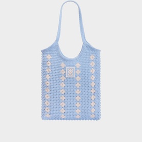 Sandro sky blue crochet tote bag with white daisy embellishments, logo patch, and short shoulder straps