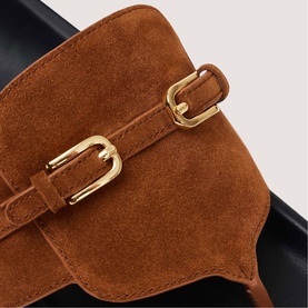 Sandro brown suede loafer detail showing gold-tone buckle strap accent
