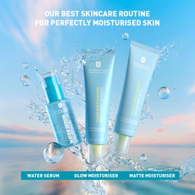 Erborian skincare trio featuring Water Serum, Glow Moisturiser and Matte Moisturiser in light blue packaging against a sky backdrop.