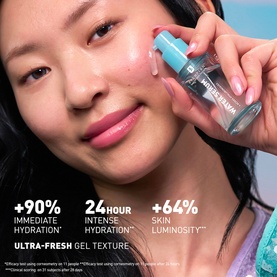 Model with Erborian Water Serum, applying the blue bottle to cheek. Text highlights 90% hydration, 24hr intense hydration, 64% luminosity.