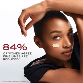 Model with Lanc&ocirc;me Absolue Longevity Anticipate Cream applied to cheek, with 84% fine lines reduced claim overlaid on image.