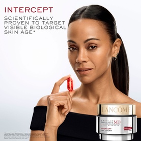 Model with Lanc&ocirc;me Absolue Longevity Intercept Cream, holding a single red capsule, jar displayed in foreground