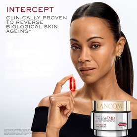 Model with Lanc&ocirc;me Absolue Longevity Intercept Cream, holding a red capsule, with cream jar displayed in foreground