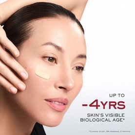 Model with Lanc&ocirc;me Absolue Longevity Reset Cream applied to cheek, with "-4yrs Skin's Visible Biological Age" claim visible