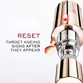 Lanc&ocirc;me Absolue Longevity Reset Serum close-up showing rose gold and silver applicator tip with red light technology activation