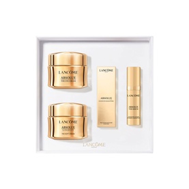 Lanc&ocirc;me Absolue skincare set featuring two face creams, a serum and an eye cream in gold packaging, presented in white gift box
