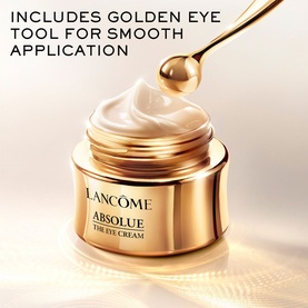 Lanc&ocirc;me Absolue The Eye Cream in gold jar with golden eye applicator tool shown above, cream texture visible