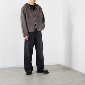 Model wearing Our Legacy Mole Grey Hairy Wool Zip Through hoodie with black wide-leg jeans and black loafers