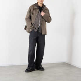 Model wearing Our Legacy Mole Grey Hairy Wool Zip Through, styled with an olive overshirt, dark wide-leg jeans and black loafers.