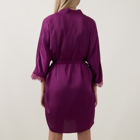 Model wearing Simone Perele Kimono in Blackberry, rear view, with lace-trimmed sleeves and self-tie belt at waist