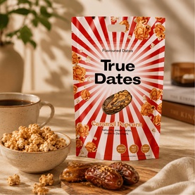 True Dates Caramel Popcorn Flavoured Dates pouch, styled with caramel popcorn, dates, and a coffee cup on a warm neutral surface.