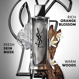 YSL Myslf Intense Eau de Toilette bottle in silver-toned flacon with YSL logo, styled with crystal, driftwood, and white florals