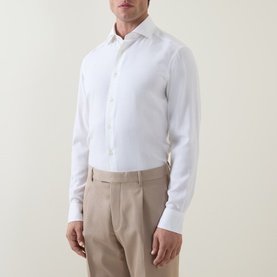 Model wearing Zegna Cashco Casual Shirt in white with semi-spread collar and long sleeves, styled with beige tailored trousers