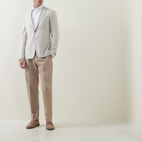 Model wearing Zegna Cashco Casual Shirt in white with beige blazer, taupe trousers and suede loafers