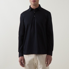 Model wearing Zegna navy cotton long-sleeve polo shirt, styled with light beige trousers. Three-button placket, ribbed collar.