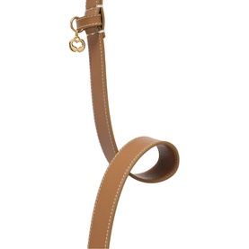 Maje brown leather adjustable shoulder strap with gold-tone hardware and contrast stitching detail.