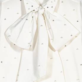 Maje metallic ivory blouse detail with oversized satin bow and scattered crystal embellishments