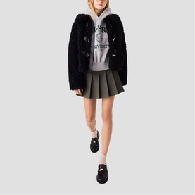 Model wearing Maje Womens French Dress in red, styled with black textured jacket, grey hoodie and black loafer shoes
