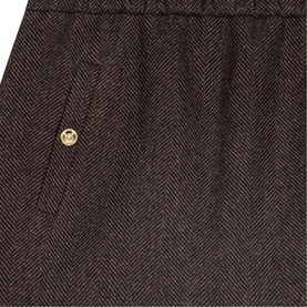 Maje Womens French Dress in dark brown herringbone fabric, close-up of pocket with gold logo button detail.