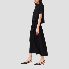 Model wearing Maje Womens French Dress in red, midi length with short sleeves and flared skirt, styled with black slingback heels.