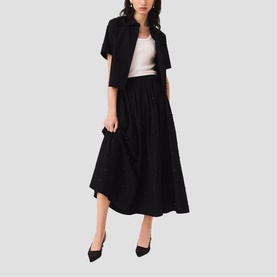 Model wearing Maje Womens French Dress in red, styled with a cropped jacket and black heels