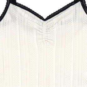 Maje metallic white knit top with vertical ribbed texture and black lace trim neckline detail
