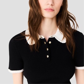 Model wearing Maje red ribbed knit polo top with contrast white ruffle collar and gold button placket, short sleeves