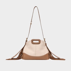 Maje bag in black with fringe detail, tan leather trim, cutout top handle, and adjustable crossbody strap, gold-tone hardware