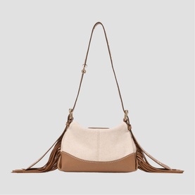 Maje bag in black with fringe detail, two-tone body, long adjustable shoulder strap, and gold-tone hardware