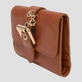 Maje tan leather compact wallet with gold-tone clasp hardware and chain detail, tri-fold style.