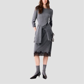 Model wearing Maje Womens French Dress in red, styled with a lace-hem midi skirt, grey socks and black kitten heels
