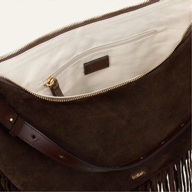 Bash brown suede bag with open zip top revealing cream interior, gold-tone hardware and fringe trim detail visible at base.