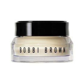 Bobbi Brown Vitamin Enriched Face Base+ day cream in a clear glass jar with black lid, containing pale cream formula