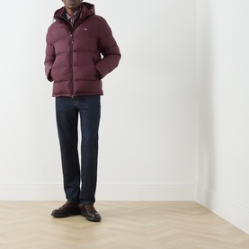 Model wearing Gant darkened wine puffer casual jacket with hood, styled with navy jeans and brown leather shoes