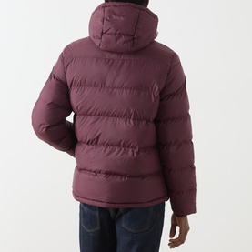 Model wearing Gant Casual Jacket in Darkened Wine, rear view showing quilted puffer design with hood, styled with dark denim jeans.