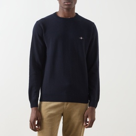 Model wearing Gant Navy Wool Crew Neck jumper with embroidered logo, styled with khaki trousers