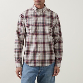 Model wearing Gant Reg Shirt in deep grape wine plaid check, long sleeve with button-down collar, styled with light wash jeans.