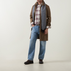 Model wearing Gant Deep Grape Wine Reg Shirt in check cotton, styled with olive coat, grey scarf and blue straight-leg jeans.