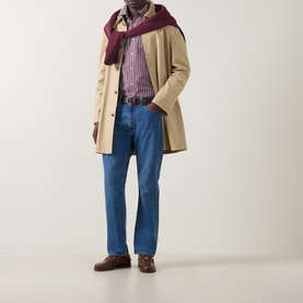 Model wearing Gant Deep Grape Wine regular fit cotton shirt, styled with beige overcoat, burgundy scarf, and blue jeans.
