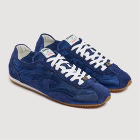 Sandro blue suede retro trainers with white lace-up front, perforated toe box, branded tongue label and gum rubber sole