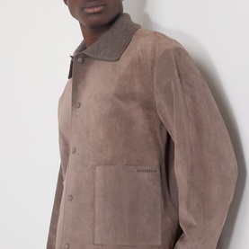 Model wearing JW Anderson Mouse Grey suede casual jacket with contrast collar and patch pockets, button fastening