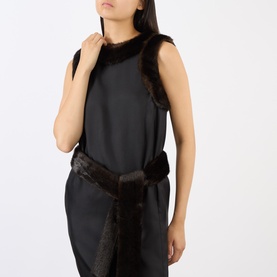 Model wearing Loulou Studio Black/Grizzly silk dress with faux fur trim at neckline and belted waist detail, sleeveless silhouette.