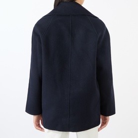 Model wearing Loulou Studio navy melange wool-cashmere jacket, shown from the back, with wide lapels and relaxed silhouette.