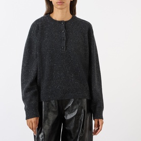 Model wearing Loulou Studio Malo Half-Buttoned Sweater in Peppered Anthracite, crew neck, half-button placket, long sleeves, styled with brown