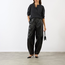 Model wearing Loulou Studio Malo Half-Buttoned Sweater in Peppered Anthracite, styled with dark brown wide-leg trousers and brown loafers, small