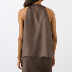 Model wearing Loulou Studio dark brown silk halterneck top, shown from behind, with matching skirt